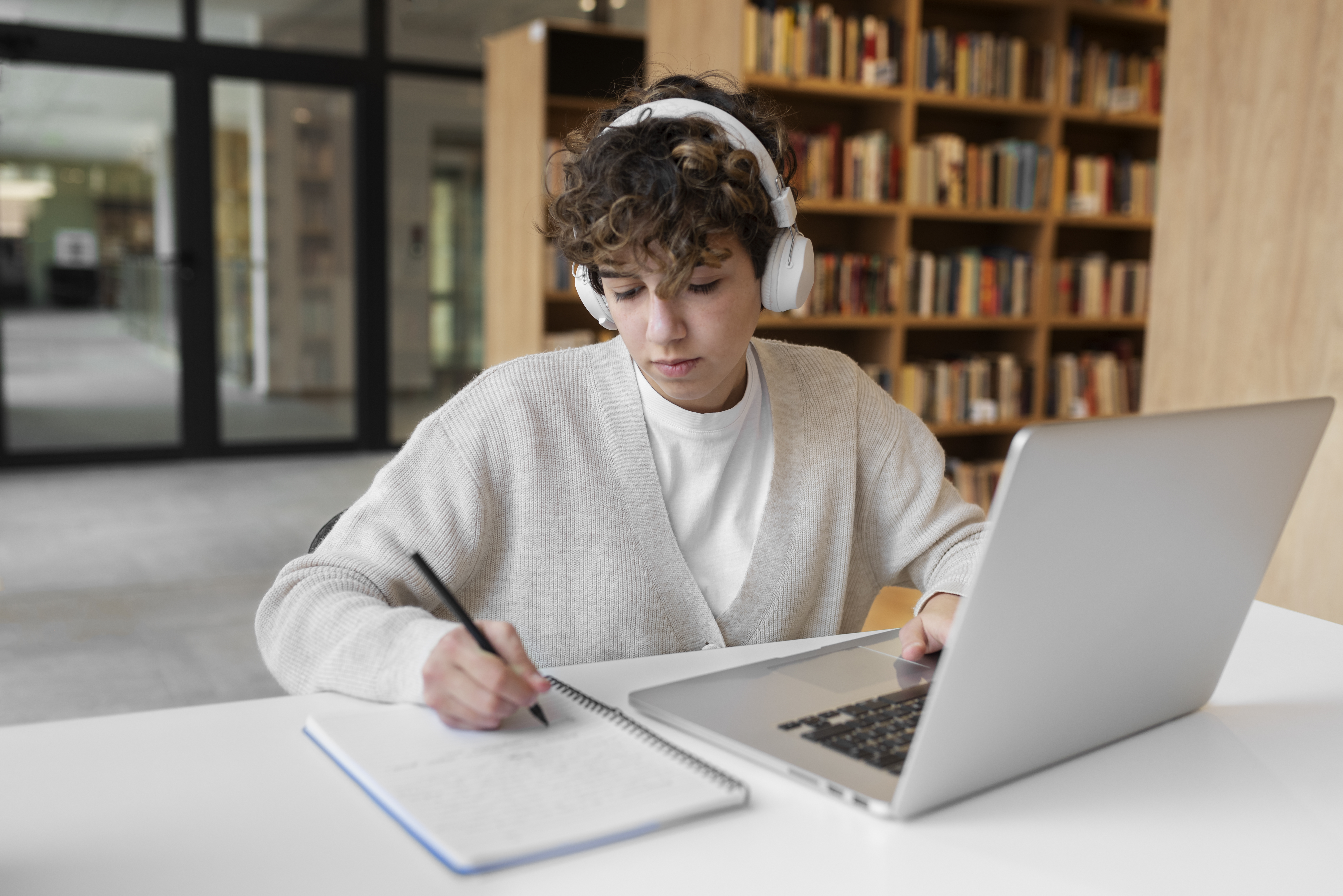 young student learning in library